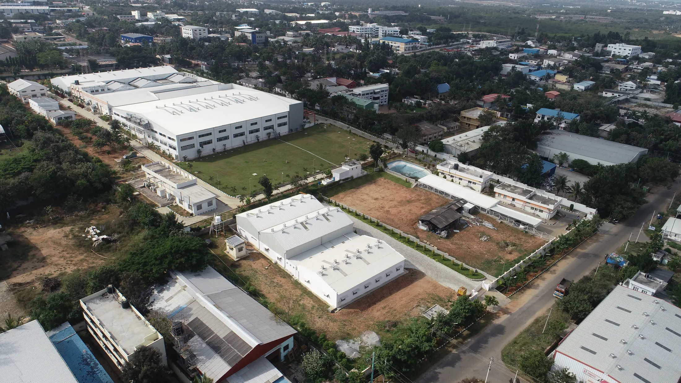 Aerial drone view of the Pattabi Enterprises campus in Mysuru